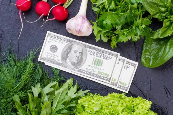 Fresh vegetables and money.