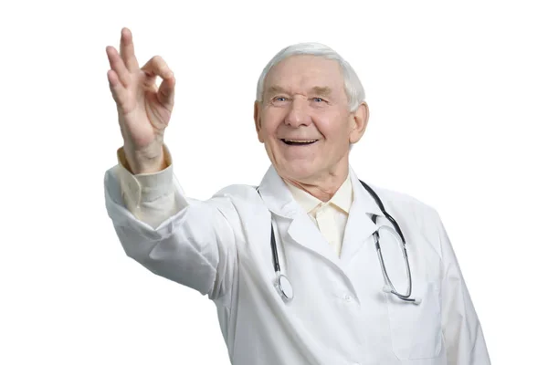 Portrait of old surgeon with ok gesture. — Stock Photo, Image