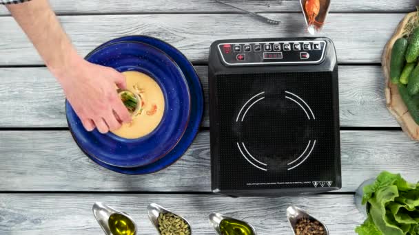 Hand garnishing soup. — Stock Footage Hand garnishing soup. Stock Footage