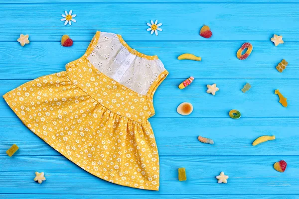 Cotton baby-girl dress, rubber candies.