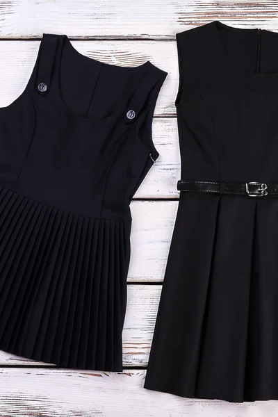 School girls classic black dresses.