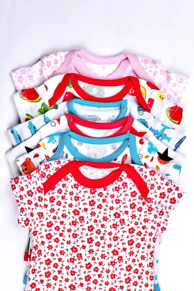 Set of printed bodysuits for newborn babies.