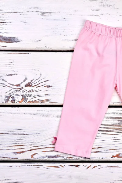 Little girl light pink breeches. — Stock Photo, Image