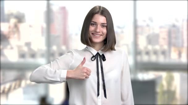 Young charming lady on blurred background. — Stock Video