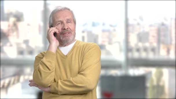Cheerful grandfather talking on mobile phone. — Stock Video
