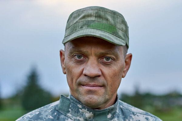 Portrait of serious soldier face, close up.