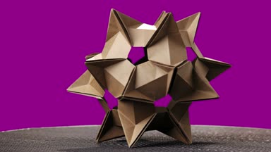 Dikenli origami şekil renkli arka plan üzerinde.