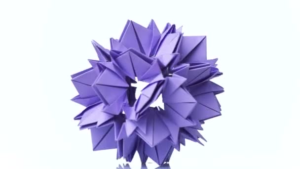 Origami flower of violet color. — Stock Video