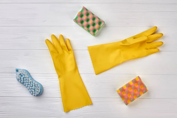 Kitchen sponges and rubber gloves.
