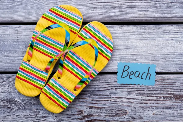 Beach footwear concept, yellow sandals.