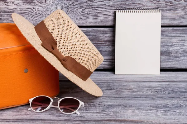 Women accessories and blank notepad.