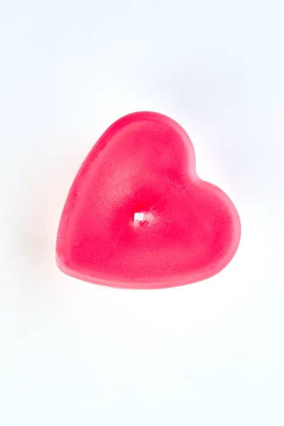 Red heart shaped candle, top view. Stock Image