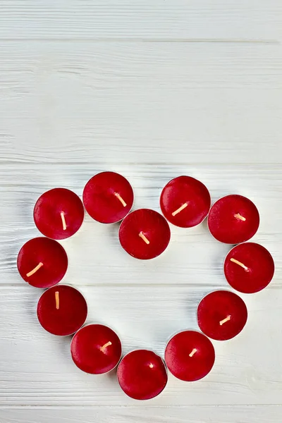 Red heart from candles and copy space.