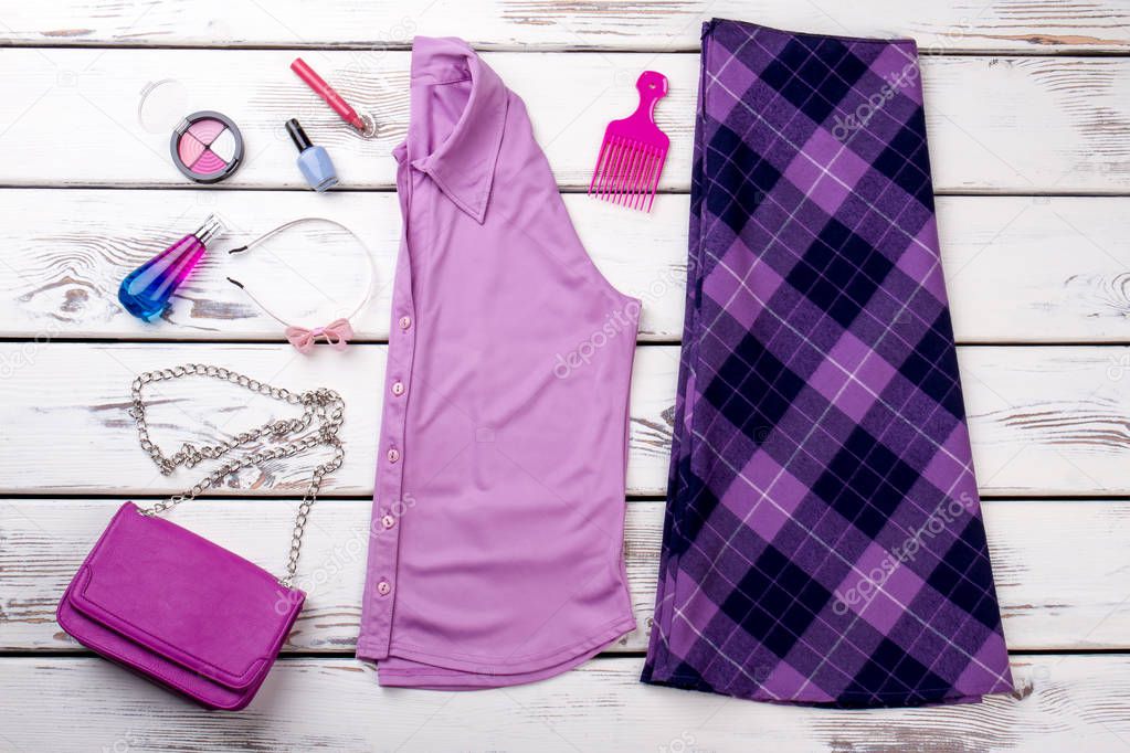 Female purple color clothes and accessories.