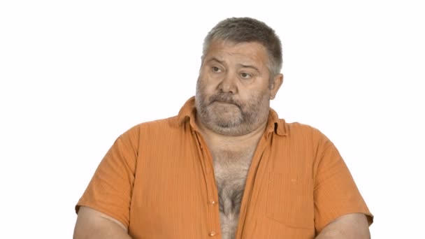 Portrait of thoughtful fat man on white background. — Stock Video