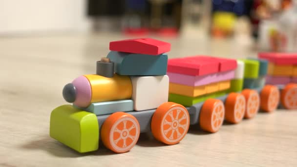 Childs wooden train toy on the floor. — Stock Video