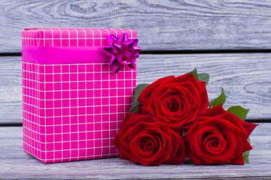 Valentines Day gift box and red roses. clipart