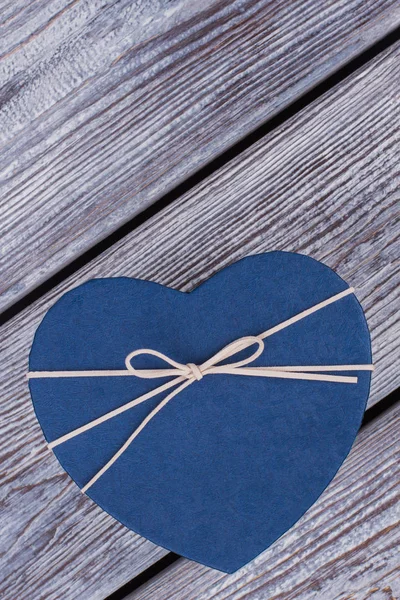 Blue heart-shaped gift box.