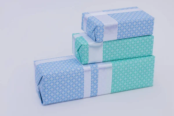 Row of gift boxes on light background. — Stock Photo, Image