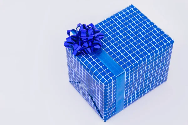 Big gift box in blue wrapping paper. — Stock Photo, Image