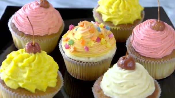 Set of cupcakes with colorful frosting. — Stok video