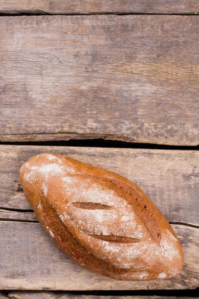 Pão fresco no fundo do vintage . — Fotografia de Stock