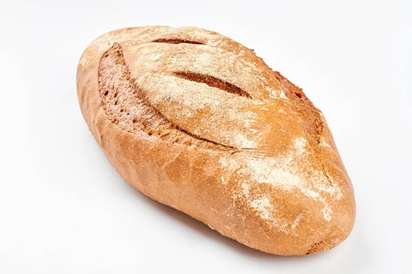 Whole loaf of a crispy bread on white background. — Stock Photo, Image