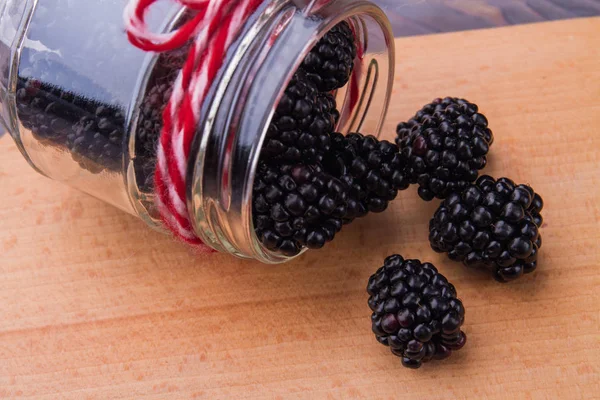 Fallen jar of berries close-up. — Stock Photo, Image