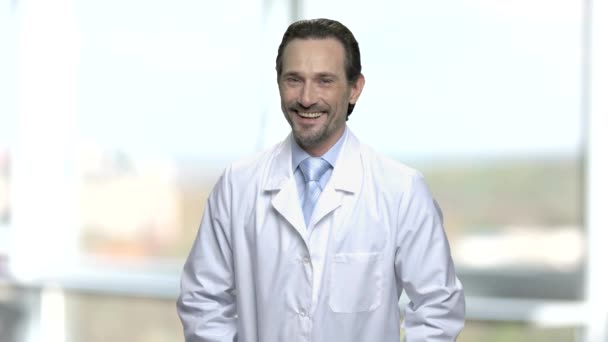 Portrait of laughing mature man in lab coat. — 비디오