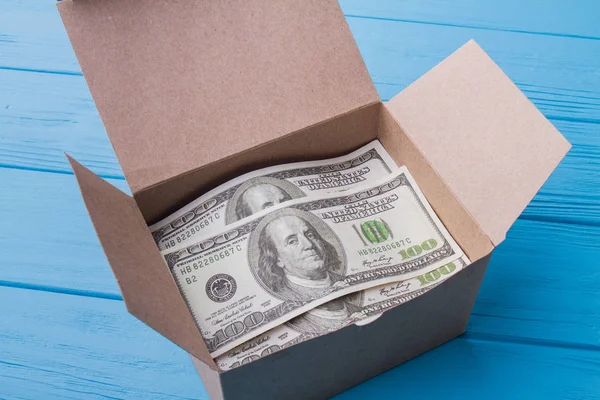 Cardboard mail box with dollars. — Stock Photo, Image