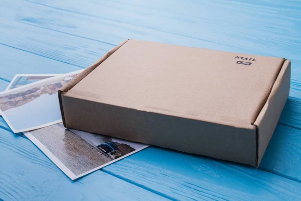 Cardboard carton box with photos, close-up. — Stock Photo, Image