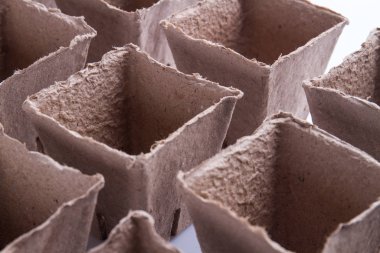 Close-up cardboard fibre square pots.