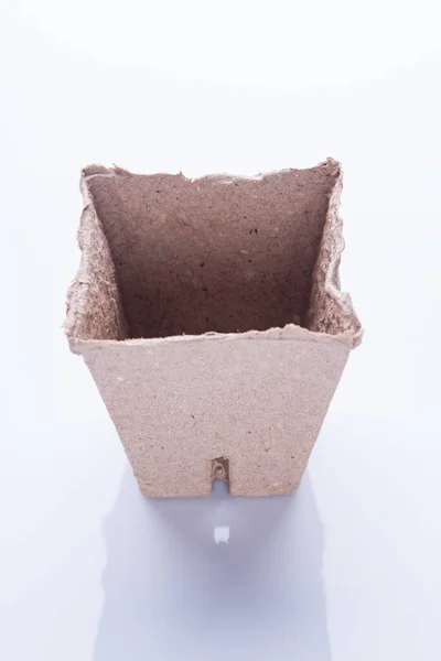 Garden square fibre cardboard pot close-up. Stock Image