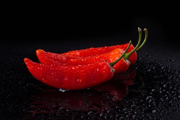 Hot red peppers with tails. — Stock Photo, Image