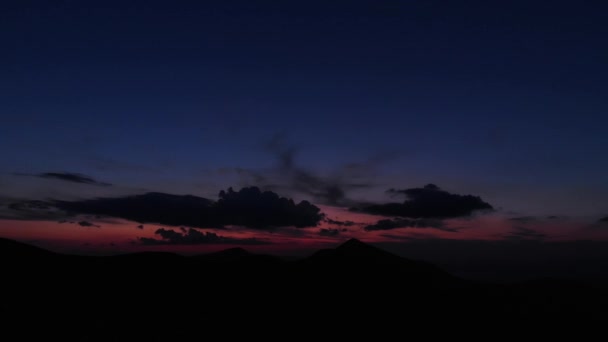 Silhouette of mountains under sunset sky with clouds. — 비디오