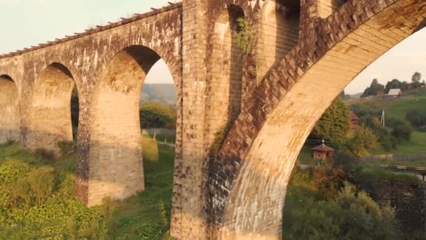 Old stone bridge in Carpathian mountains in summer. — Stock Video