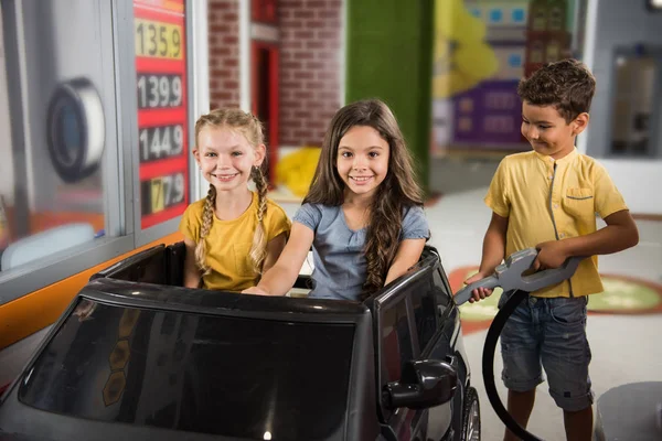 Kids playing gas station in playroom. — ストック写真