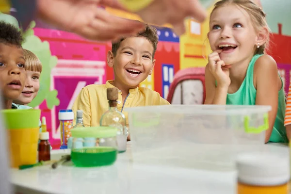 Positive happy kids at chemistry show in playroom. — Stock Photo, Image