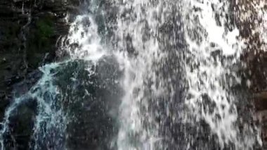 Cascade closeup, water flow in slow motion.