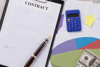 Contract, calculator and sticker.