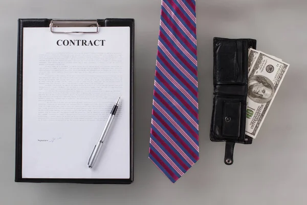 Signed contract with tie and wallet. — Stock Photo, Image