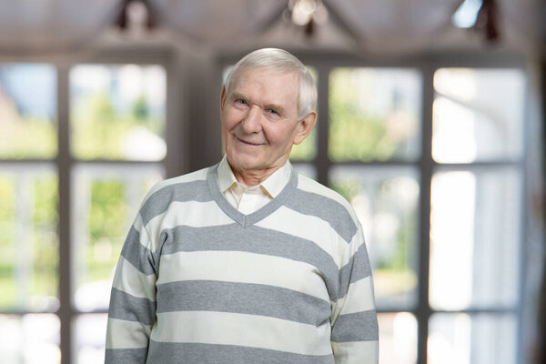 Portrait of very old man is smiling.