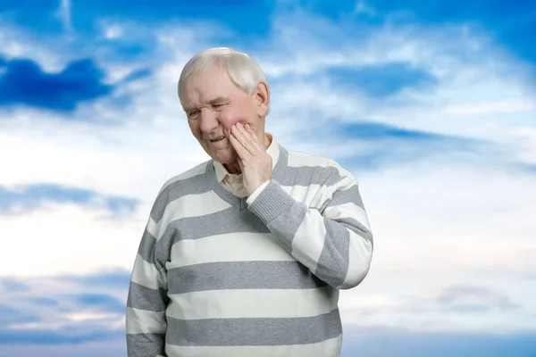 Old grandfather with toothache. — Stockfoto