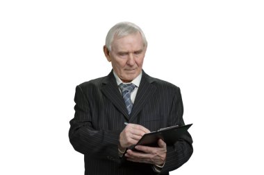 Tax inspector wrinting note on clipboard.