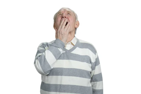 Portrait of senior man yawns. — Stock Photo, Image