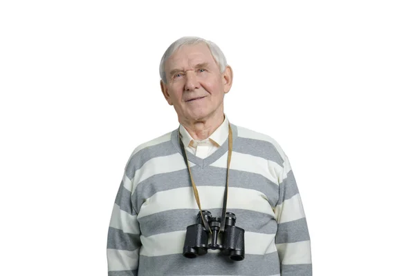 Happy senior man with binoculars round his neck. — Zdjęcie stockowe