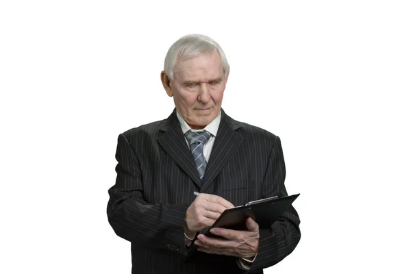 Tax inspector wrinting note on clipboard. — Stockfoto