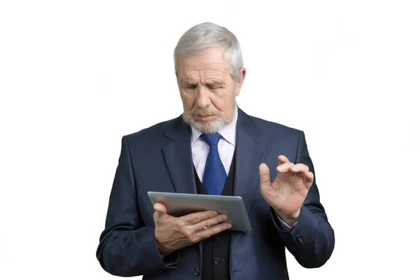 Portrait of old businessman using tablet. — Stock Photo, Image