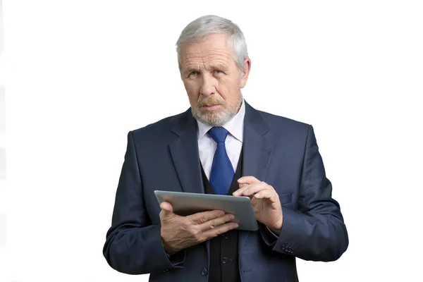 Mature businessman with tablet. — Stock Photo, Image