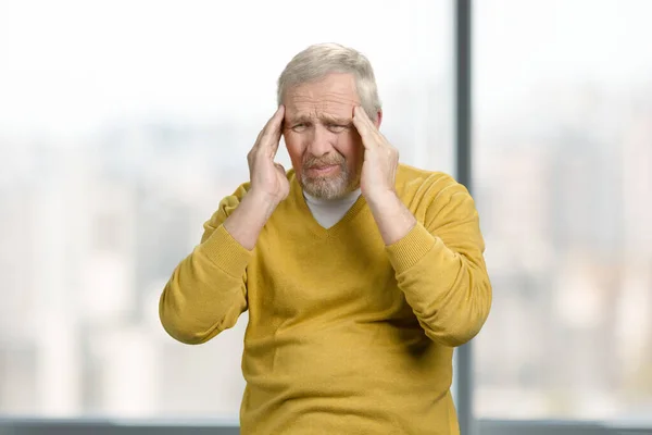 Grandpa with terrible headache portrait. — Stockfoto